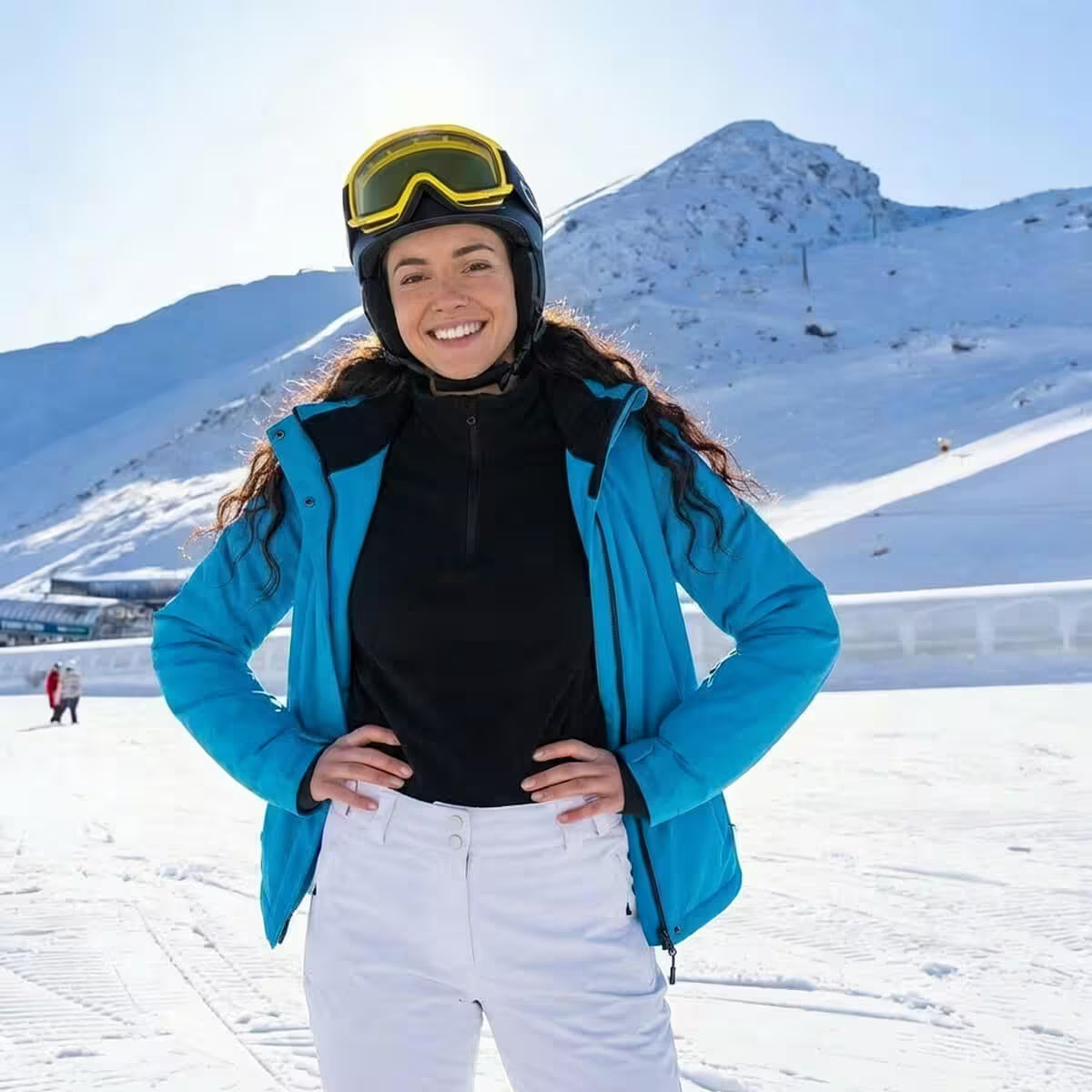 Person in ski gear with a snowy mountain background