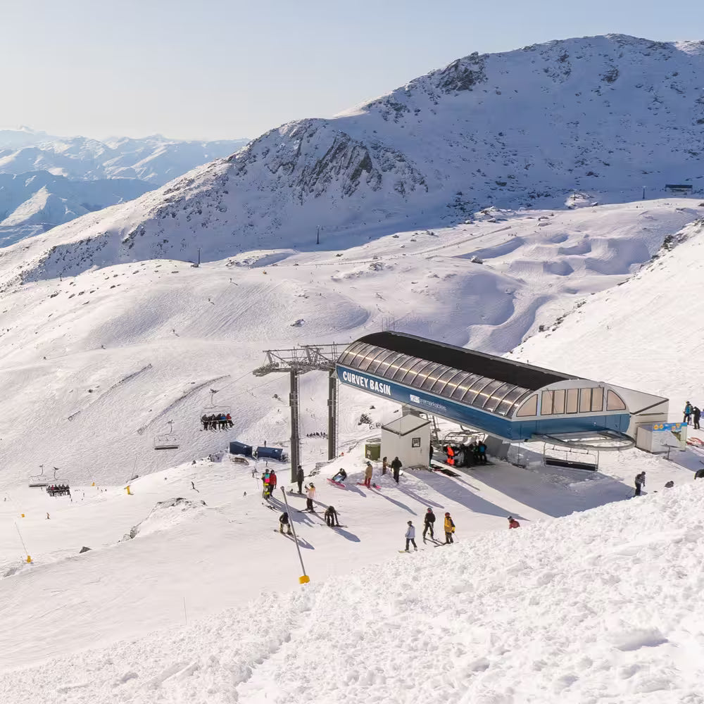 Ski resort with a building labeled 'Covey Basin' on a snowy mountain landscape.