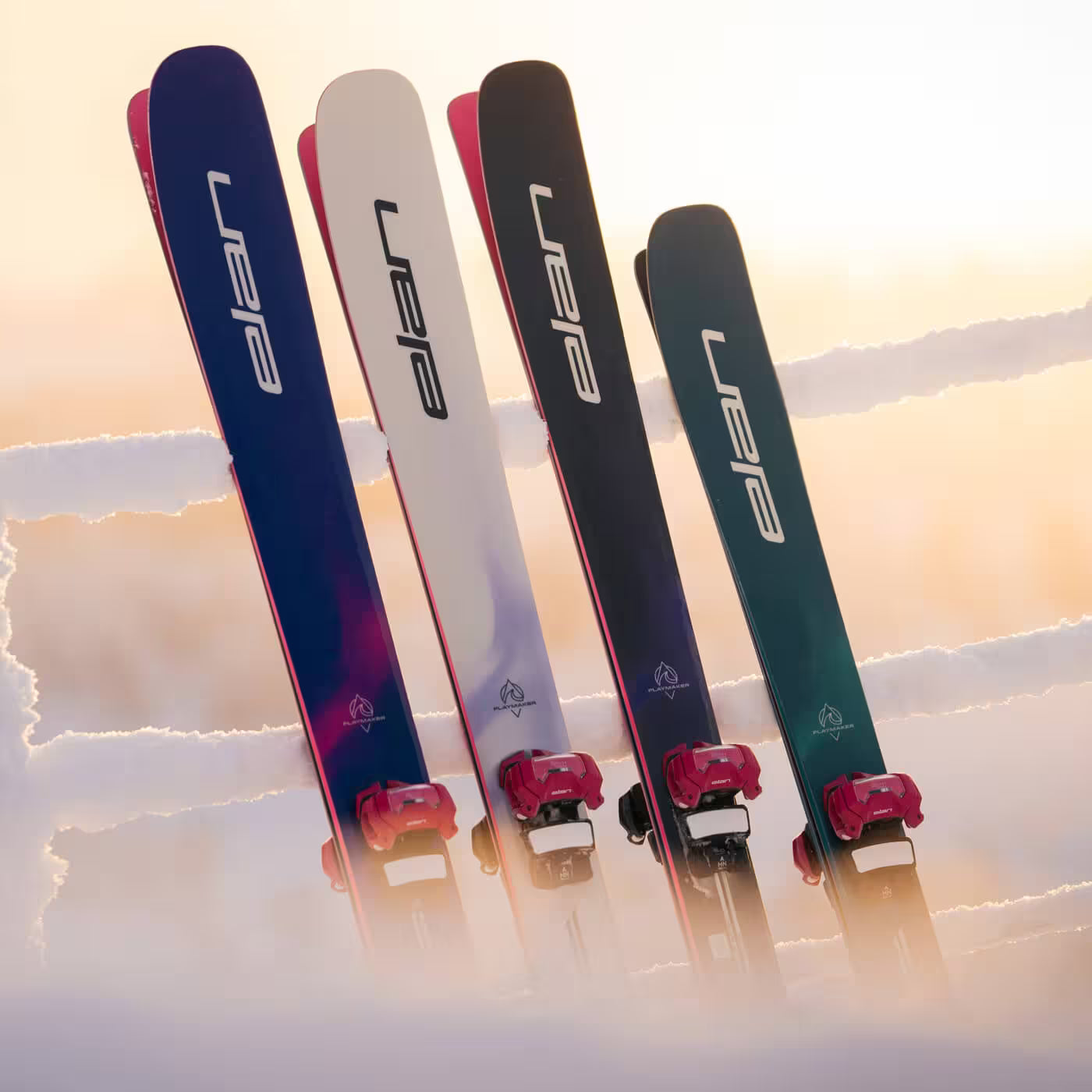 Four skis with 'elan' branding on a snowy background