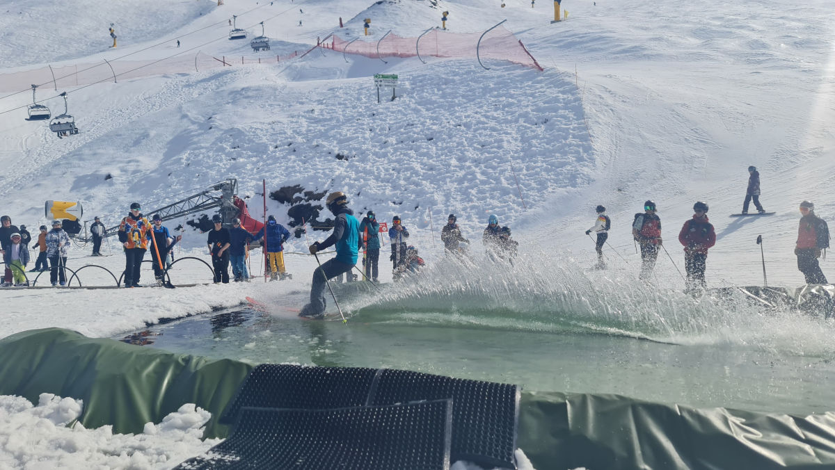 Pond skim event at a Queenstown ski field New Zealand