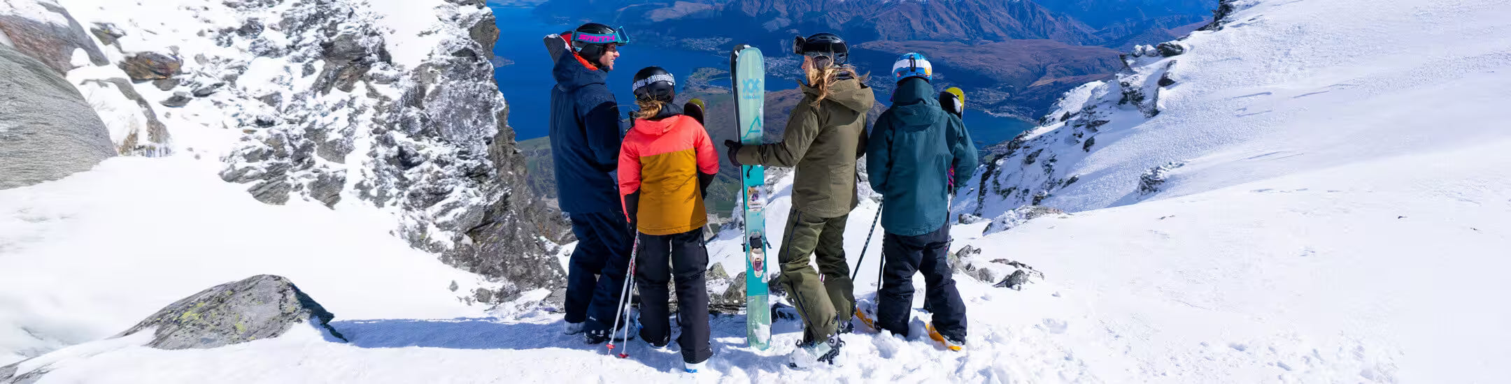 Group of skiers on a snowy mountain with ski equipment